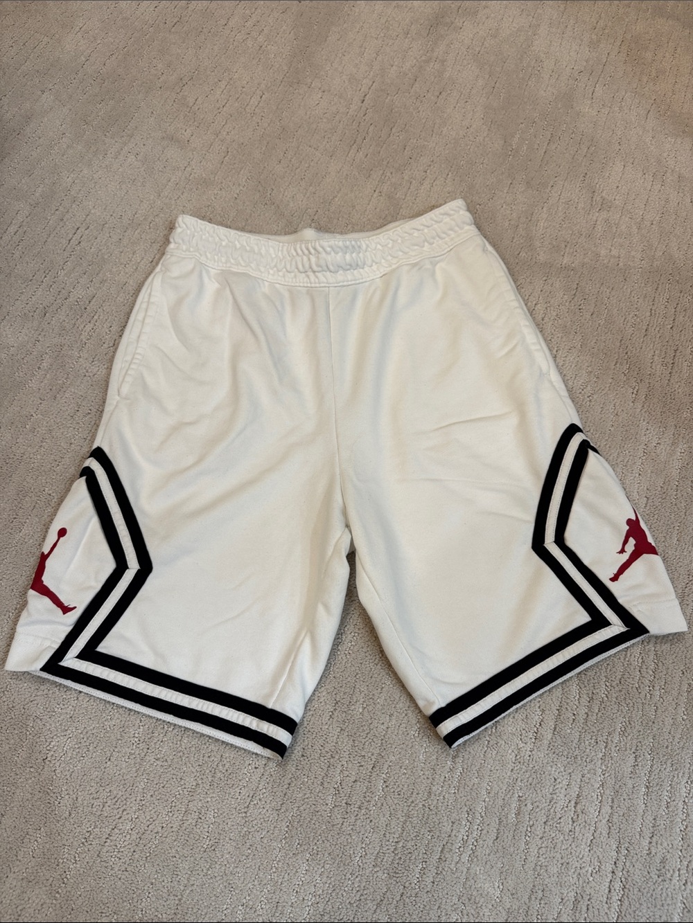 Jordan White Basketball Shorts with Black Trim and Red Jumpman